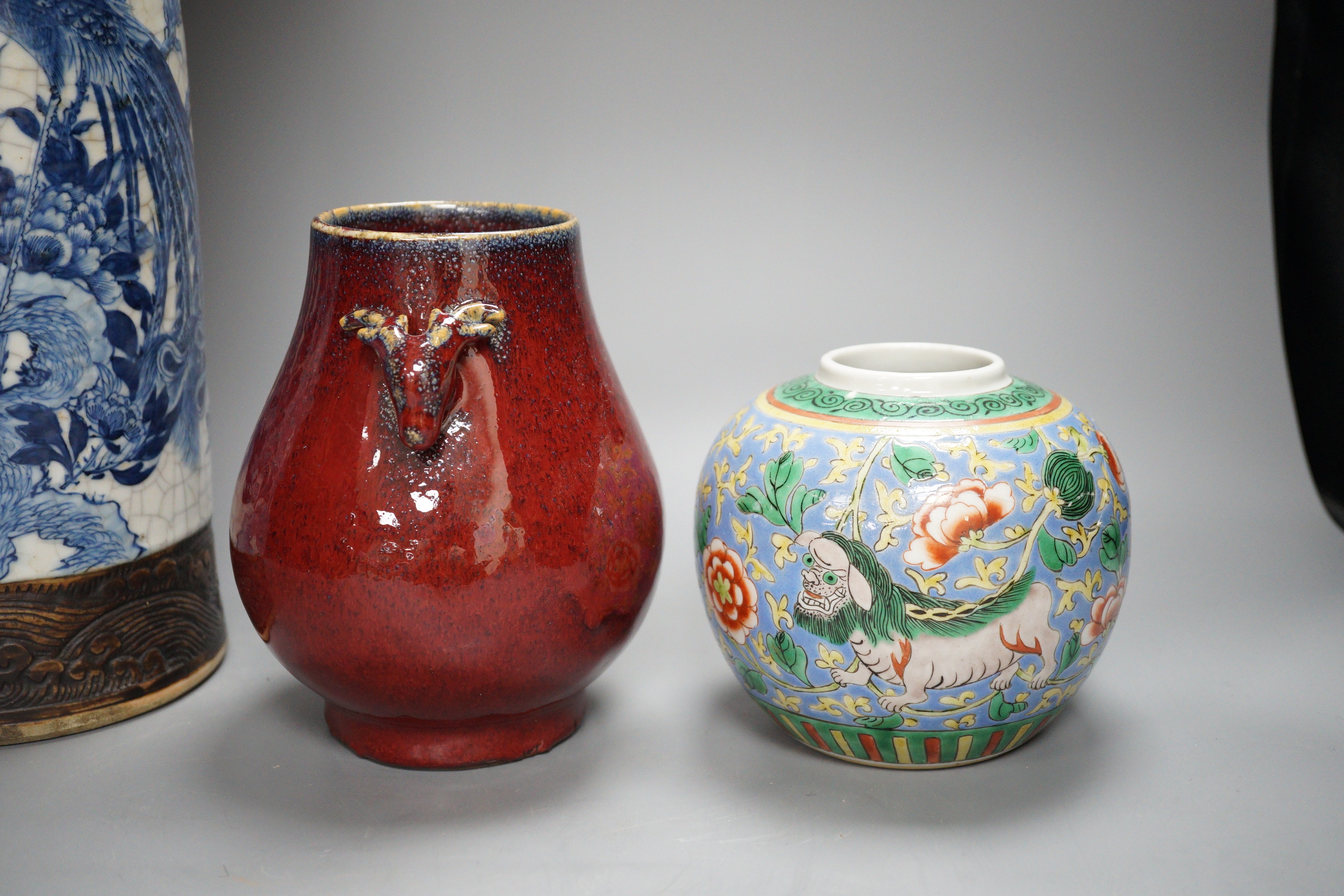 A large Chinese blue and white crackle glaze vase, a sang de boeuf vase and a monochrome jar, tallest 40cm